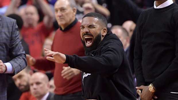 Drake cheers during a game.